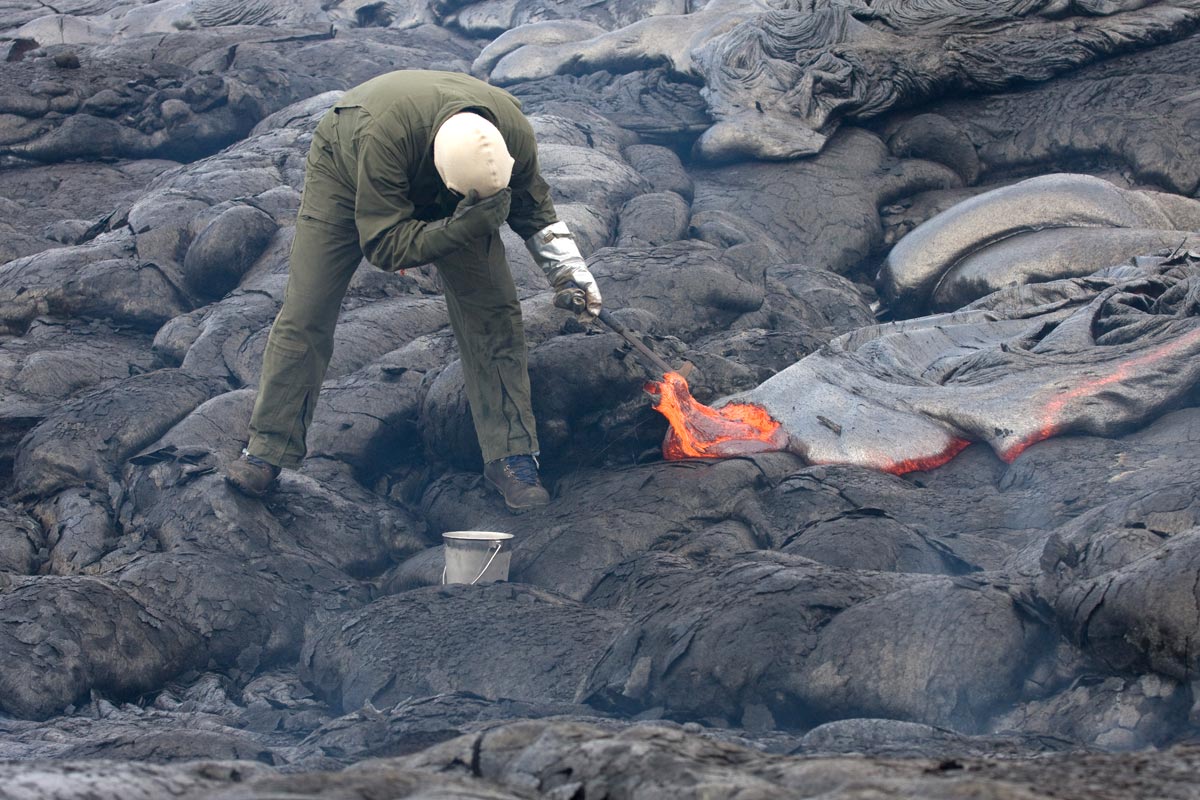 Taking a sample of lava at Kilauea